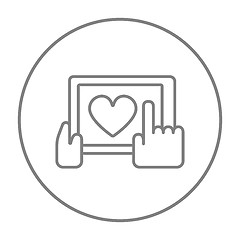 Image showing Hands holding tablet with heart sign line icon.