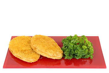 Image showing Chicken Schnitzel on red plate