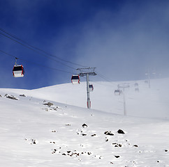 Image showing Gondola lifts and ski slope in mist