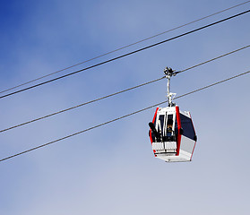 Image showing Gondola lift with ski and snowboards