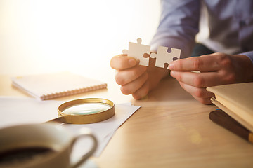 Image showing Building a business success. The hands with puzzles