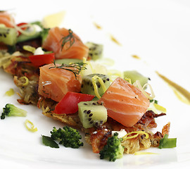 Image showing Fried potato cakes with smoked salmon