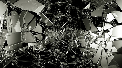 Image showing Pieces of splitted or cracked glass on black