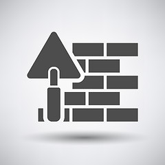 Image showing Brick wall with trowel icon