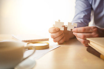 Image showing Building a business success. The hands with puzzles