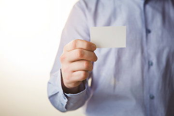 Image showing Man holding white business card 