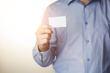 Image showing Man holding white business card 