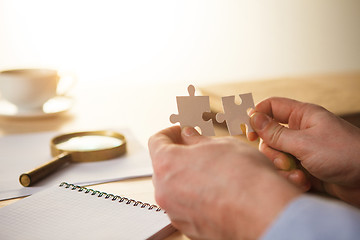 Image showing Building a business success. The hands with puzzles