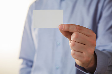 Image showing Man holding white business card 