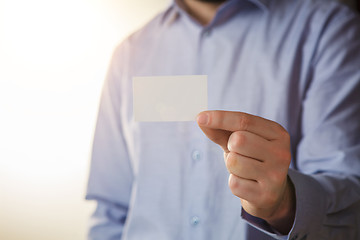 Image showing Man holding white business card 