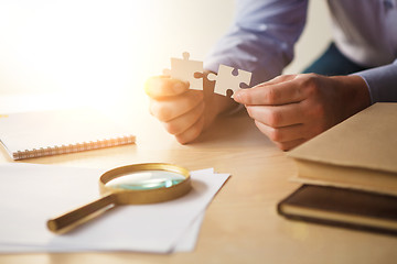 Image showing Building a business success. The hands with puzzles