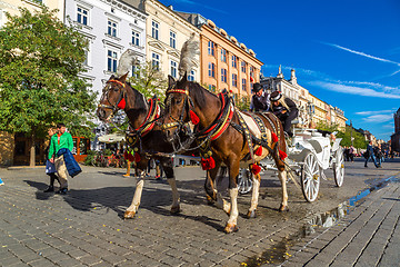 Image showing Horse carriages at main square in Krakow