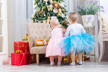 Image showing baby girl with christmas present