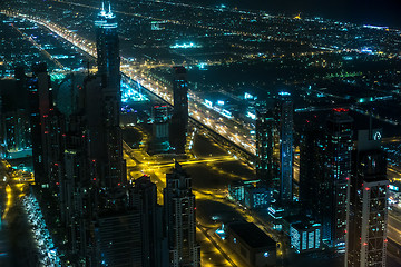 Image showing Dubai downtown night scene with city lights,