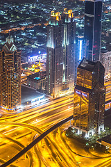 Image showing Dubai downtown night scene with city lights,