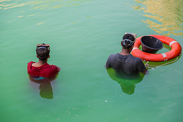 Image showing Workers in uniform are cleaning pool