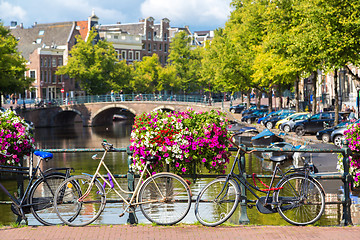 Image showing Bicycles on a bridge over the canals of Amsterdam