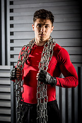 Image showing muscular young guy with chain