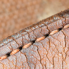 Image showing Close-up of old stiches in leather