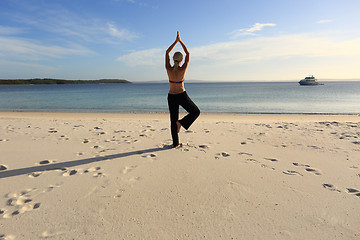 Image showing Woman balancing on one leg yoga pose