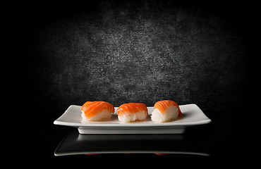 Image showing Three sushi on black