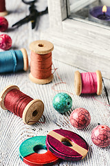 Image showing Beads and sewing thread