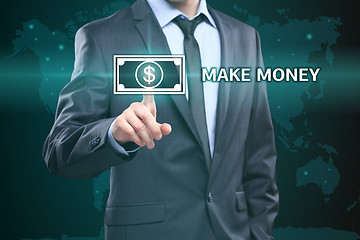 Image showing business, technology, internet concept - businessman pressing make money button on virtual screens