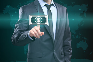 Image showing Businessman presses digital interface dollar sign 