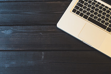 Image showing Laptop on modern wooden desk 