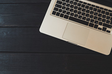 Image showing Laptop on modern wooden desk 