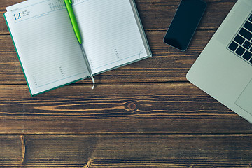 Image showing Laptop and diary on the desk