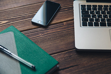 Image showing Laptop and diary on the desk