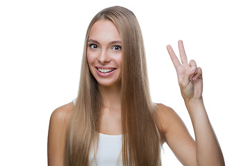 Image showing Beautiful woman shows gesture v