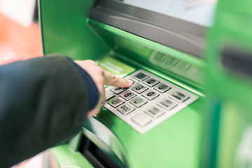 Image showing Close-up of hand entering PIN