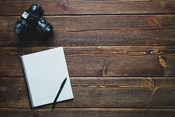 Image showing notebook and vintage camera on the desk