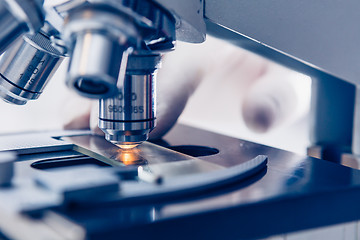 Image showing Scientist hands with microscope