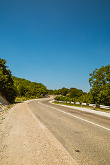 Image showing Curved asphalt road in mountains 