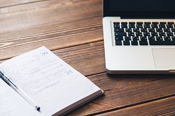 Image showing Laptop and diary on the desk