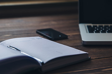 Image showing Laptop and diary on the desk