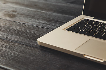 Image showing Laptop on modern wooden desk 