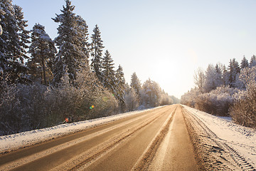 Image showing Winter road through snowy forests