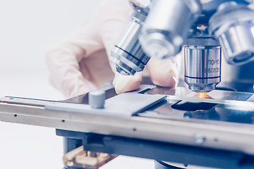 Image showing Scientist hands with microscope