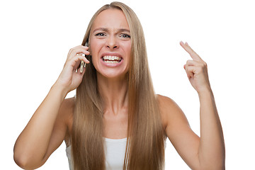 Image showing Angry woman talking on phone