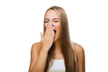 Image showing Woman yawns of boredom on white background