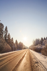 Image showing Winter road through snowy forests