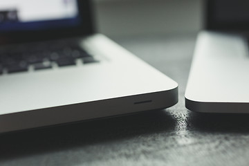 Image showing Two laptops on modern wooden desk 