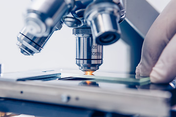 Image showing Scientist hands with microscope