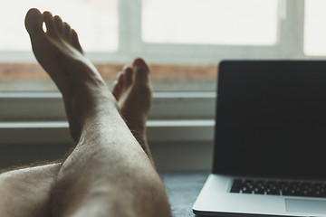 Image showing Man took a break from work 