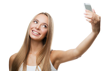 Image showing beautiful woman make selfie on white background