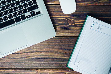 Image showing Laptop and diary on the desk